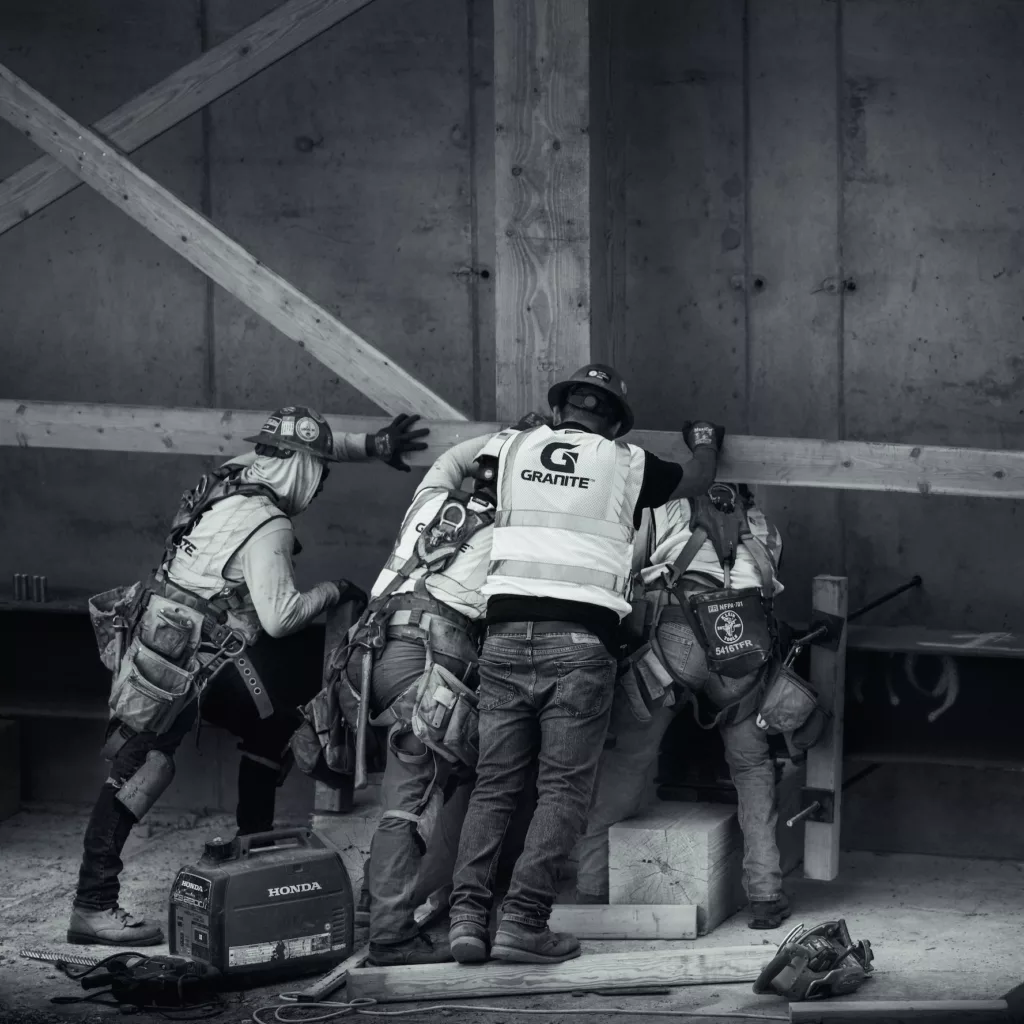 Construction Crew in Black and White Teamwork by Daniel Mekis