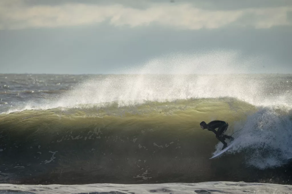 Cool surfing image of Billy Scott getting barreled at wave in New Jersey Surf Photography Technique