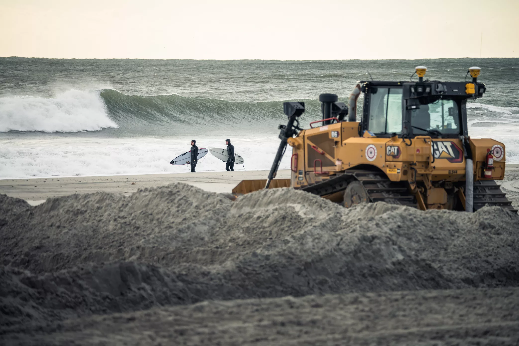 Bulldozer with surfers looking at the waves wallpaper cool surf pic